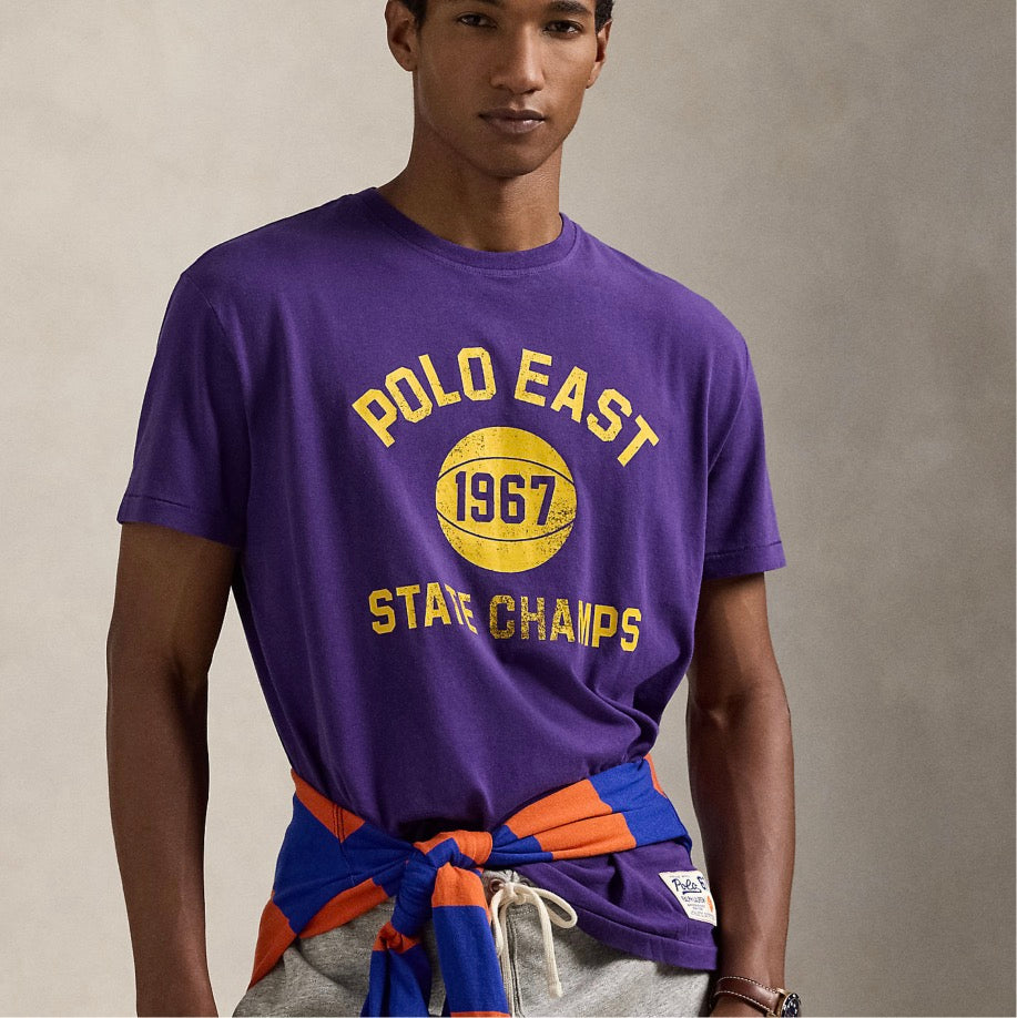 "Polo East 1967 State Champs" and a basketball graphic printed at the center front. "Polo Ralph Lauren 67 Athletic Outfitters" basketball label at the left hem.