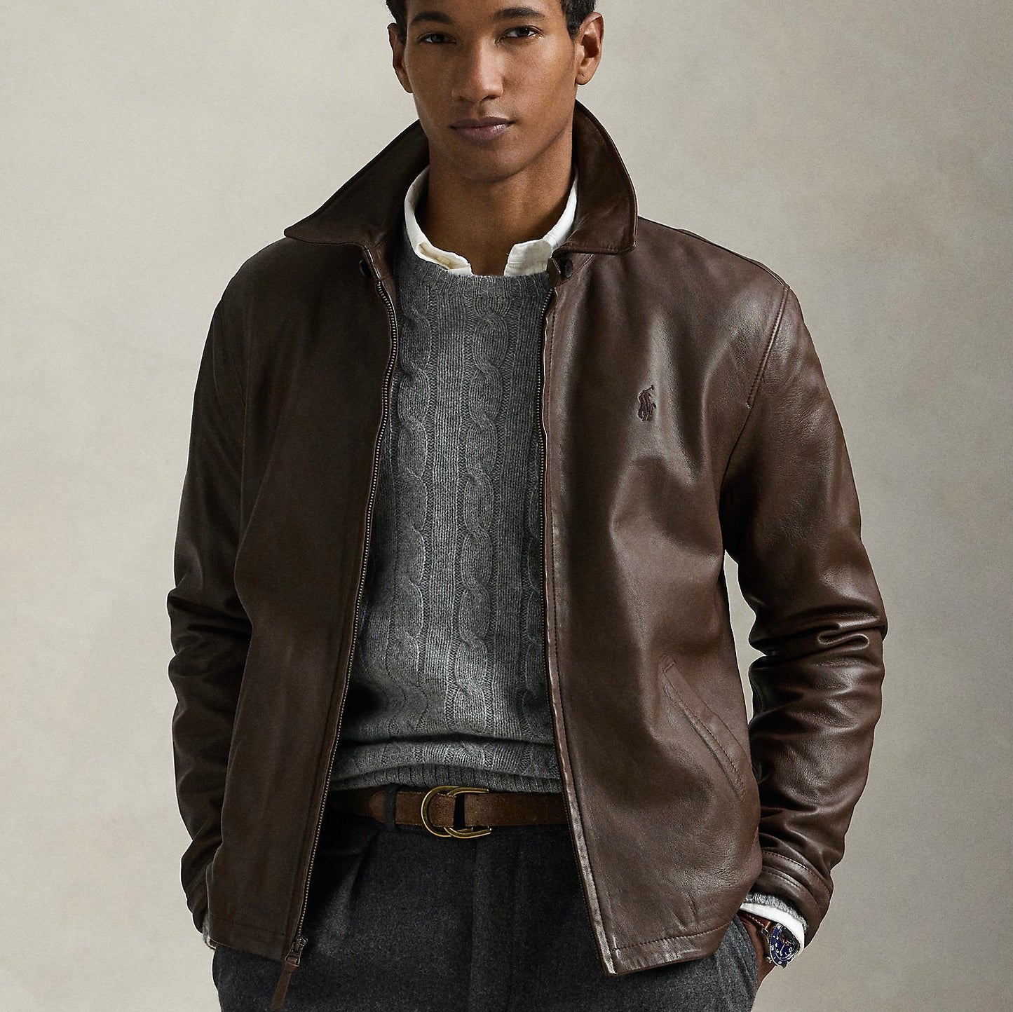 This jacket merges the sporty silhouette of a windbreaker with supple, full-grain leather. Plaid lining gives it a heritage-inspired touch.