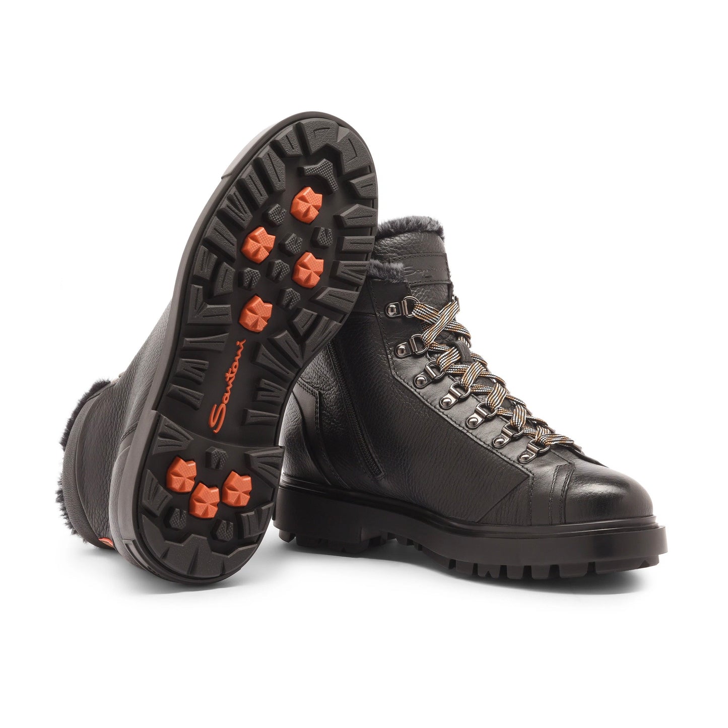 Functional design meets meticulous attention to detail to add an exclusive touch to your off-duty edit. This Santoni ankle boot is crafted from tumbled leather and lined in soft shearling for superior protection on winter’s coldest days. Hiking-style criss-cross laces and eyelets toughen up the look with outdoorsy attitude, whilst contrast details on the rubber sole reveal a flash of signature Santoni orange with every stride.