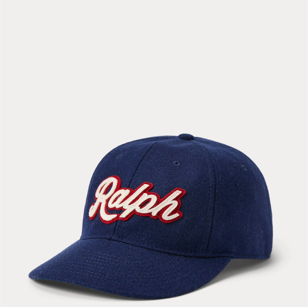 An appliquéd patch honoring our founder accents this wool-blend ball cap, which is finished with a leather strap and chain-stitched logo embroidery at the back.