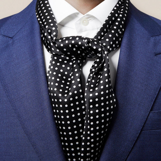 This silk scarf with polka dots adds pattern and texture to your everyday style. Elevate your classic outfit or layer it with your tie and suit.