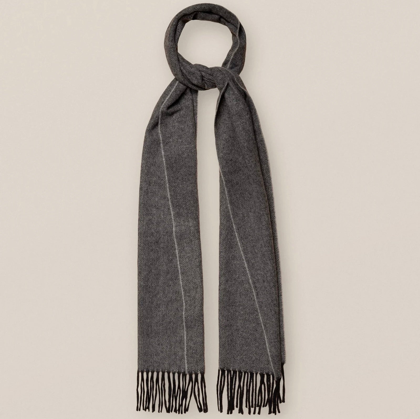 One of our most classic scarf designs, updated in seasonal colors. Made in Italy with 100% wool, this herringbone wool scarf is part of our Wardrobe Essentials program. An ideal scarf for cold weather that suits both tailored business and a more casual-oriented outfit.