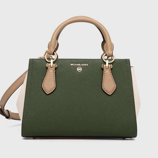 Our Marilyn crossbody bag will top off any look with polished charm. Rendered in Saffiano leather with a color-blocked finish, it features sleek accordion sides, an array of pockets and a snap closure to keep your essentials secure. Style it with the season’s ultra-feminine looks.