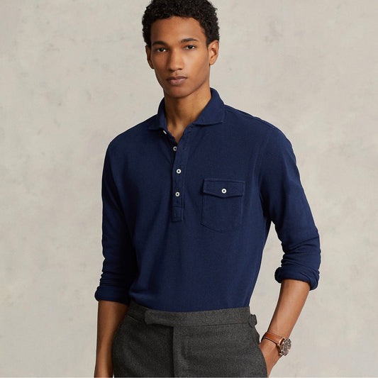 Four-button placket. Long sleeves with buttoned barrel cuffs. Left chest buttoned pocket. Even vented hem. Signature embroidered Pony at the right hem.
