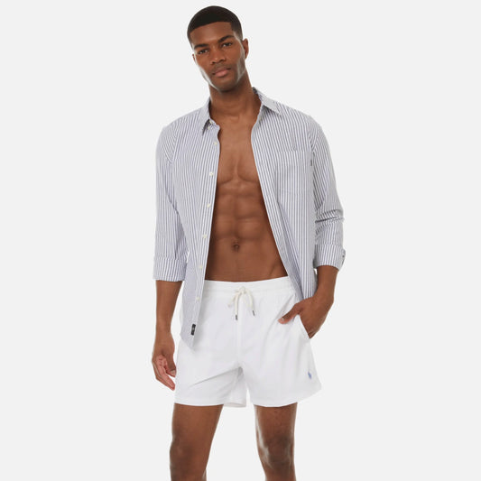 The Polo Ralph Lauren Traveler Trunk is Polo's classic swim shorts with mesh lining and signature embroidered fringe for a sleek yet relaxed polo look. 