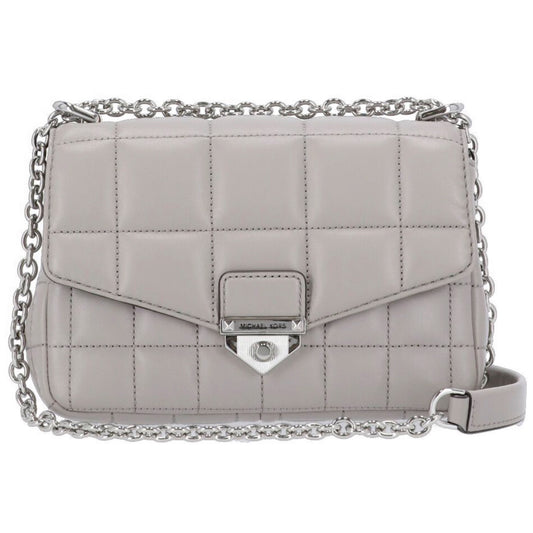 The beloved SoHo shoulder bag, named after the iconic New York City neighborhood, is crafted from leather with a chic quilted finish for a mix of uptown polish and downtown cool. A push-lock fastening opens to a petite interior sized to stow your cards, keys and lipstick, while an exterior back pocket will keep your phone within arm’s reach.