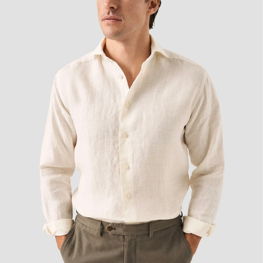 An elegant solid-color casual shirt cut from a rich and lustrous 100% linen twill fabric with a beautiful structure. his lightweight and breathable piece is garment-washed for extra softness and comfort.