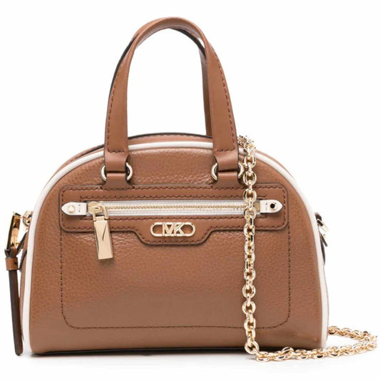 This mini-sized version of the Williamsburg bag features pebbled leather punctuated with contrasting trim and gold-tone hardware. The beauty lies in its versatility—it can be carried hands-free with the help of the chain-link strap, or in hand by the top handles. It’s perfect for so many occasions, day or night.